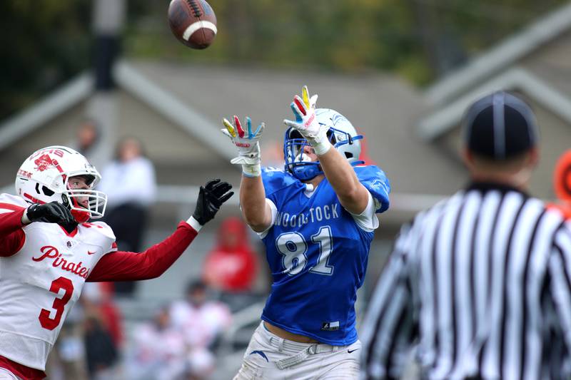 Woodstock’s Keaton Perkins, right, tracks a pass as Ottawa’s Hayden Swett defends in varsity football at Larry Dale Field on the campus of Woodstock High School Saturday.