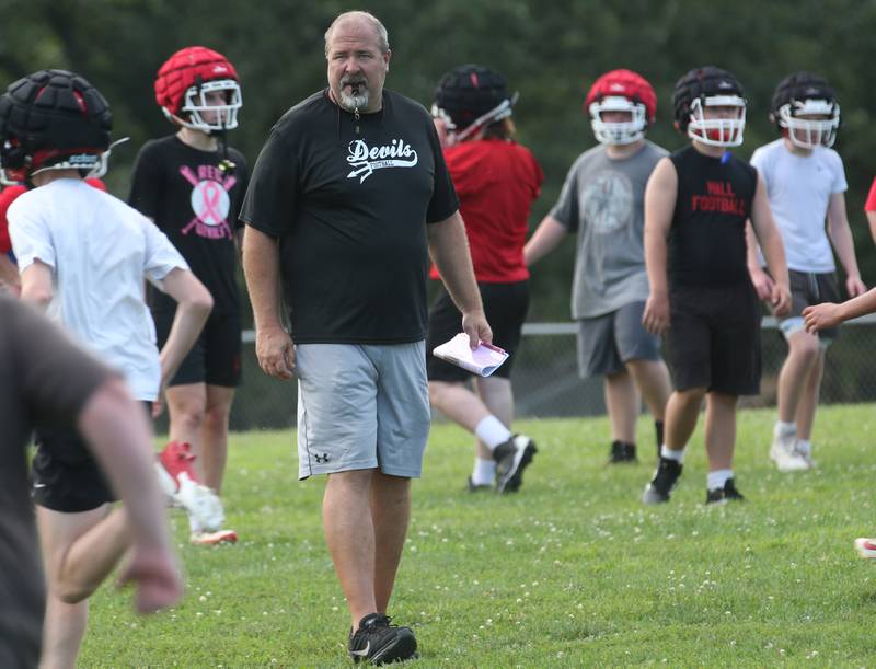 Hall football head coach Nick Sterling, watches his team during the first day of football practice on Monday, Aug. 11, 2025 at Hall High School.