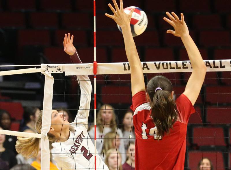 Lockport's Emily McGraw has her spike blocked by Marist's Maggie Kurpeikis during the Class 4A State semifinal game on Friday, Nov. 15, 2024 at CEFCU Arena in Normal.