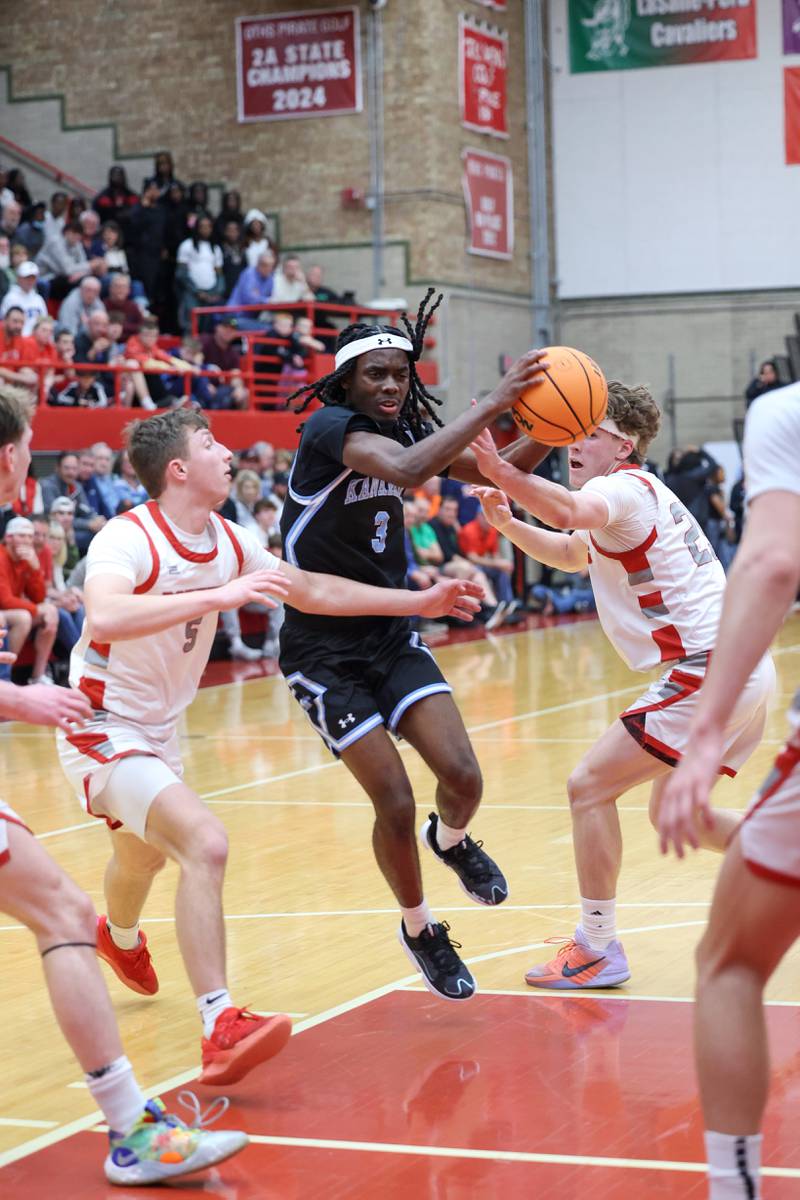 Kankakee's Cedric Terrell III maneuvers through the lane during the Kays' 61-48 loss to Morton in the IHSA Class 3A Ottawa Sectional championship on Friday, March 6, 2026.