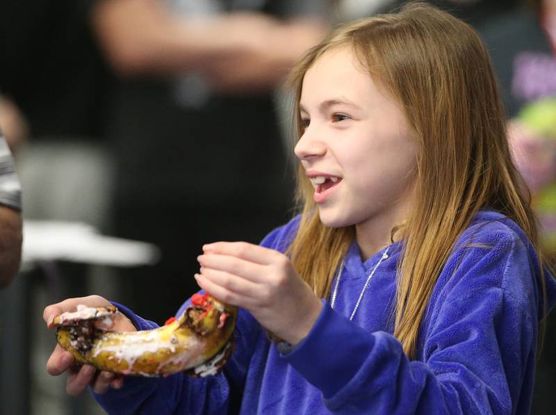 Shaylee Engel a student at Putnam County Junior High School, carries her banana car to the starting line during the 29th annual Edible Car Contest on Wednesday, Feb. 26, 2025 in the cafeteria at Illinois Valley Community College.