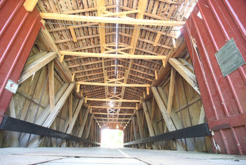An interior view of the Red Covered Bridge on Monday, June 30, 2025 in Princeton. Last Friday, the Illinois Department of Transportation announced that the historic bridge enters next rehabilitation phase. Phase II includes the preparation of a detailed cost estimate and expected to take 12 to 18 months to complete and will result in advertising a repair contract to bidders. Approximately $1 million is identified to pay for the needed repairs in IDOT’s most recent multiyear program. A view of the Red Covered Bridge on Monday, June 30, 2025 in Princeton. Last Friday, the Illinois Department of Transportation announced that the historic bridge enters next rehabilitation phase. Phase II includes the preparation of a detailed cost estimate and expected to take 12 to 18 months to complete and will result in advertising a repair contract to bidders. Approximately $1 million is identified to pay for the needed repairs in IDOT’s most recent multiyear program. The bridge survived a number of threats, both intentional and unintentional, including arson, erosion and high winds. It also has survived several strikes by large trucks with it's most recent strike in 2023.