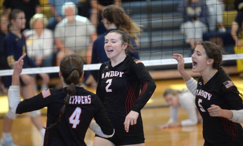 Amboy's Kiera Karlson (2) celebrates with her teammates Lili Leffelman (4) and Morgan Kreiser (5) after winning a point against at the Polo Invite on Saturday, Sept. 27, 2025.