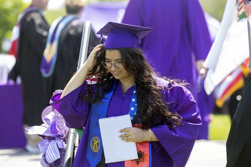 Saida Bajrami leaves the stage after receiving her diploma Sunday, May 24, 2026, at Dixon High School.
