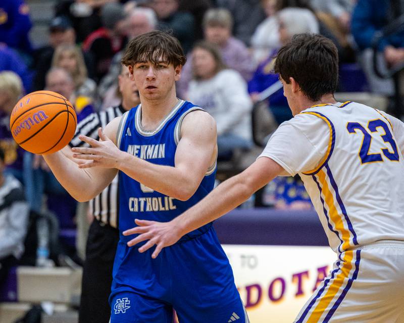 Newman's Ashton Miner (0) looks to pass ball to teammate whilst being guarded by Dane Doyle (23) of Mendota on Friday, January 30, 2026 at Mendota High School in Mendota.