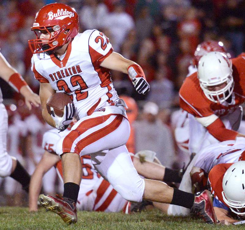 Streator's Drew Muntz, shown here in action against Ottawa last fall, was one of four Bulldogs named to the Northern Illinois Big 12 all-conference football team, it was released recently. Also tabbed were linemen Austin Benckendorf and Zac Benckendorf and linebacker Kyle Kurdziolek.