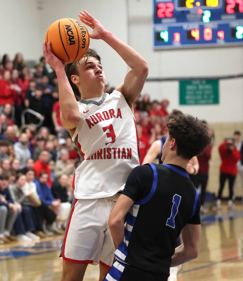 Aurora Christian's Preston Morel shoots over Hinckley-Big Rock's Sawyer Smith during their sectional final game Friday, March 7, 2025, at Somonauk High School.