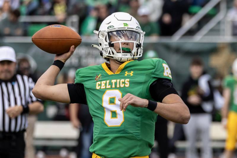Providence's Dominic Vita looks for an open teammate during a 5A varsity football playoff game against Washington at Providence on Nov. 15, 2025.