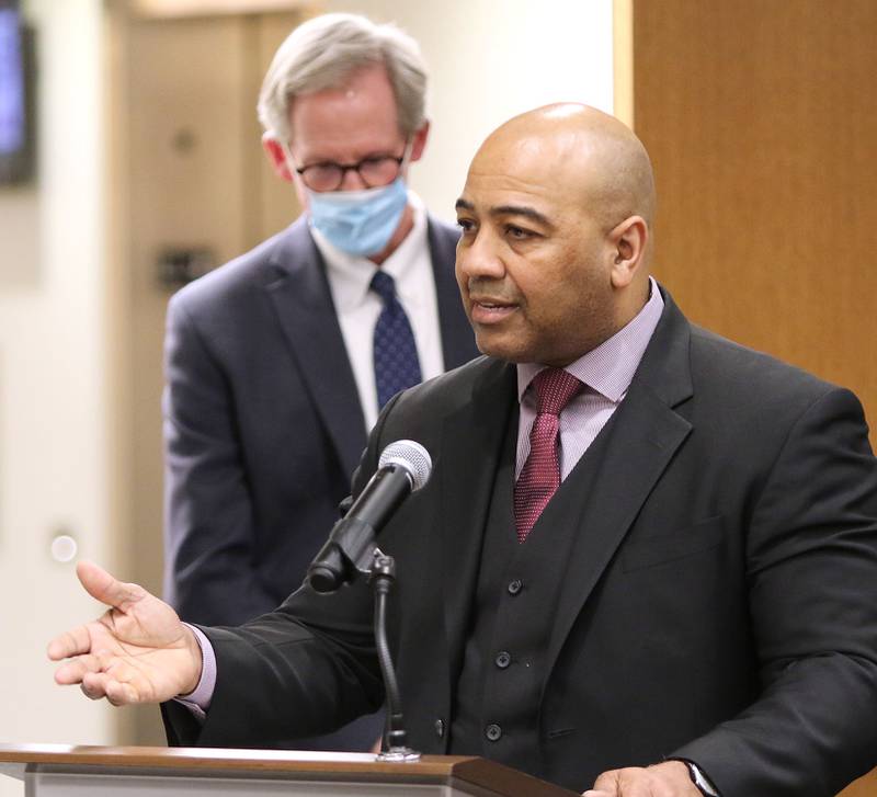 Illinois State Police Col. David Byrd speaks as City Manager Bill Nicklas looks on at the DeKalb City Council meeting Monday after Byrd was named the city's next police chief.