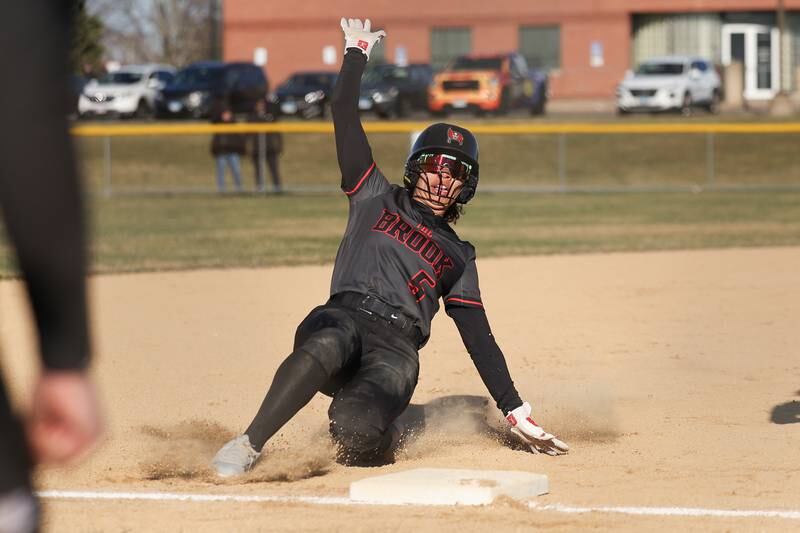 Bolingbrook’s Anaiyah Gregory slides into third against Plainfield Central on Wednesday, March 20, 2024.