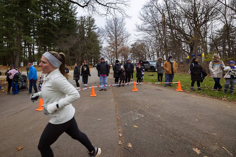 Supporters cheer on the runners Thursday, Nov. 28, 2024, during St. Anne’s Turkey Trot 5K.