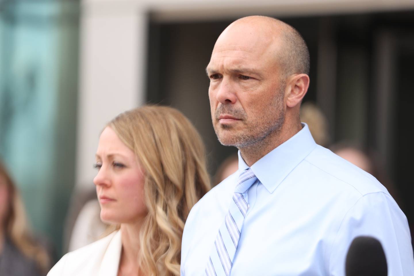 Edward Goewey and his wife Heather stand outside Will County Courthouse during a press conference. Edward Goewey, a Will County sheriff’s deputy currently on medical leave, is being charged with disorderly conduct accusing him of disturbing Mokena school officials when he insisted on the removal of a student he believed made a shooting threat at St. Mary Catholic school. Monday, April 11, 2022, in Joliet.