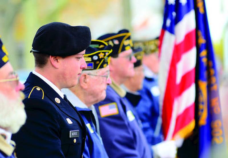 Army Private Caleb Morse, 18, of Rock Falls, stands in for another member of the Rock Falls American Legion Post 902 beside his great-grandfather, Sievio Tintori (right), during a Veterans Day ceremony last year at Rock Falls' Triangle Park.