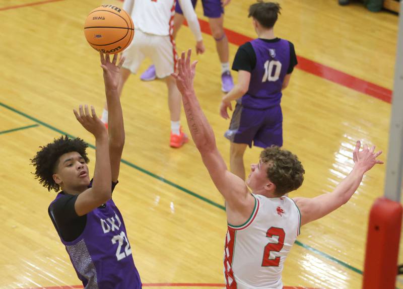 Dixon's Xavion Jones lets go of a jump shot over L-P's Regan Doerr during the Class 3A Regional semifinal game on Wednesday, Feb. 25, 2026 in Sellett Gymnasium at L-P High School.