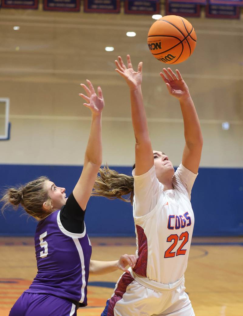 Genoa-Kingston's Regan Creadon takes a shot in front of Rochelle's Payton Cesarone during their game Monday, Dec. 16, 2024, at Genoa-Kingston High School.
