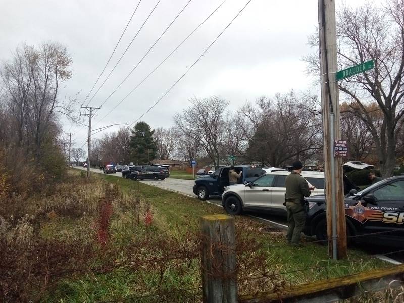 Police set up a perimeter at Drauden Road in Plainfield Township in response to a man barricading himself inside a home Friday, Nov. 22, 2024.  Joliet and Plainfield police departments along with Will County sheriff's police and SWAT unit responded.