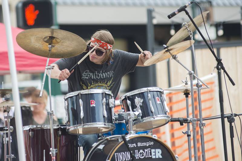 Members of the band SOMA play a Led Zeppelin cover Saturday, June 11, 2022 in downtown Dixon for the ninth annual Rosbrook Studio street fest.