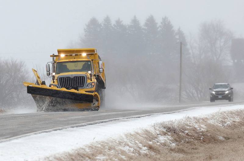 A DeKalb County snow plow heads west Thursday, Feb. 16, 2023, on Perry Road just south of DeKalb. Winter weather resulted in slippery roads and several crashes in DeKalb County Thursday.
