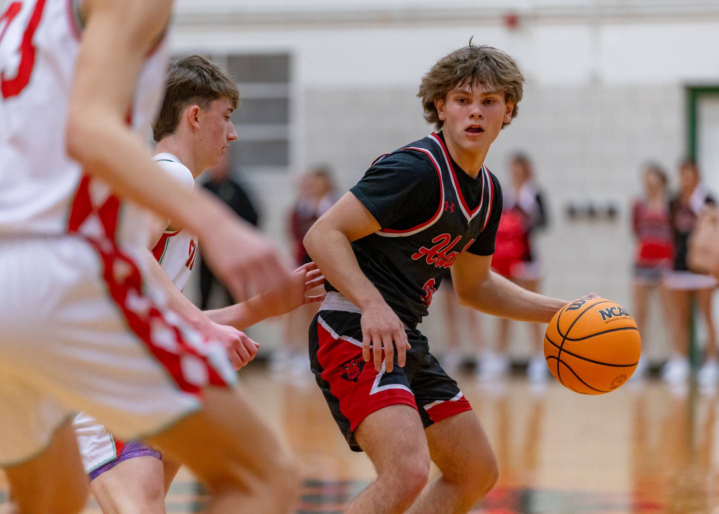 Greyson Bickett of Hall High School tries to dribble his way around LaSalle-Peru's defense during the game at Sellett Gymnasium on December 2, 2025 at LP High School.