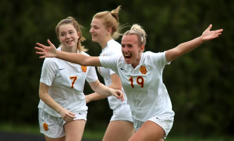 Richmond-Burton’s Layne Frericks, right, celebrates her second-half goal against DePaul Prep during sectional title game action at Marian Central in Woodstock Friday evening.