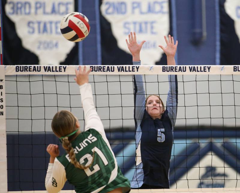 St. Bede's Johnna Bogatitus sends a spike past Bureau Valley's Kate Salisbury on Tuesday, Sept. 5, 2023 at Bureau Valley High School.