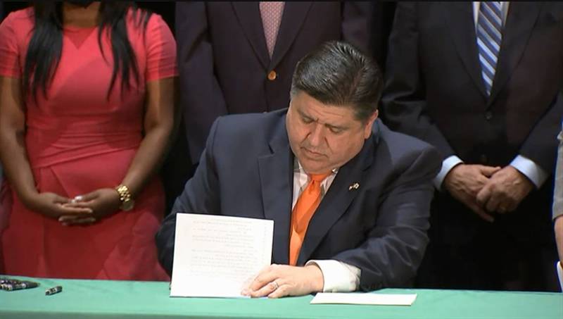 Gov. JB Pritzker signs two bills into law aimed at protecting victims of sexual assault during a signing ceremony Thursday in Chicago