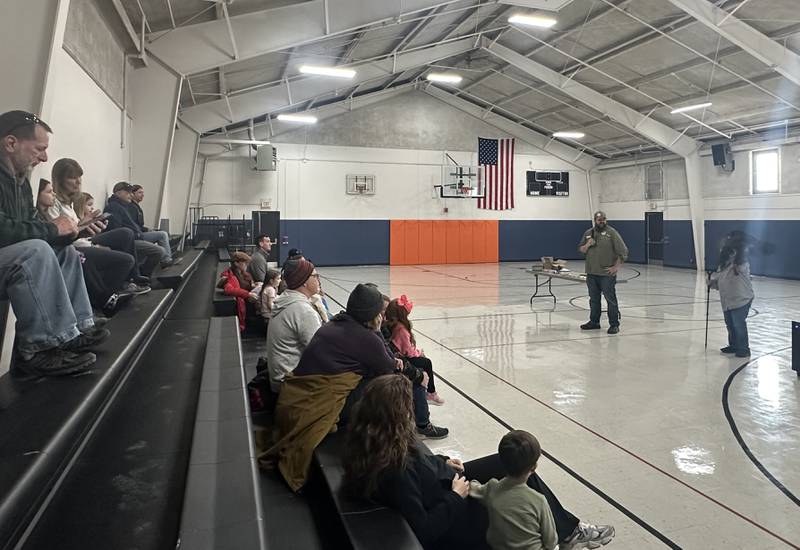 Jane Seitz Illinois Raptor Center executive director and Travis Wilcoxen Illinois Raptor Center board president present a Turkey vulture during a live birds of prey show during Eagle Watch Weekend on Saturday, Jan. 25, 2025 at the Utica Village Hall.
