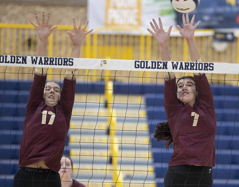 Morris’ Olivia Peterson (left) and Rosemary Misener go up for the block against Sterling Thursday, Oct. 30, 2025, in the Class 3A volleyball regional.