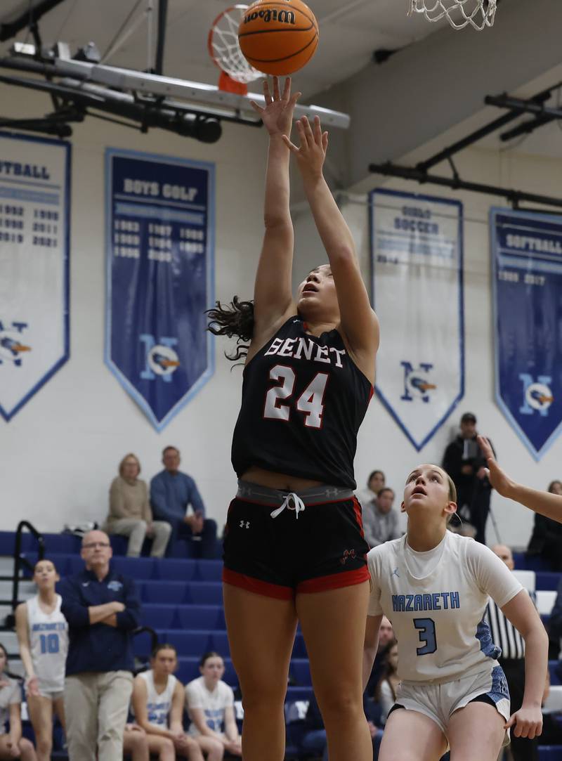 Benet's Emma Briggs (24) puts the ball up during a girls varsity basketball game between Benet and Nazareth academies on Saturday, Dec. 14, 2024 in La Grange Park.