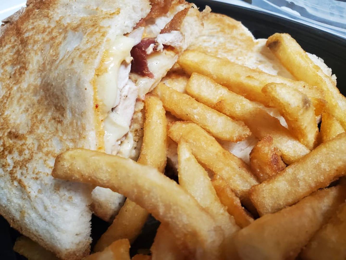 This is a chicken bacon panini with cheddar cheese and chipotle mayo from Jameson's Pub in Joliet. The menu said it's a " succulent chicken breast with applewood smoked bacon, Swiss
cheese and chipotle mayo."