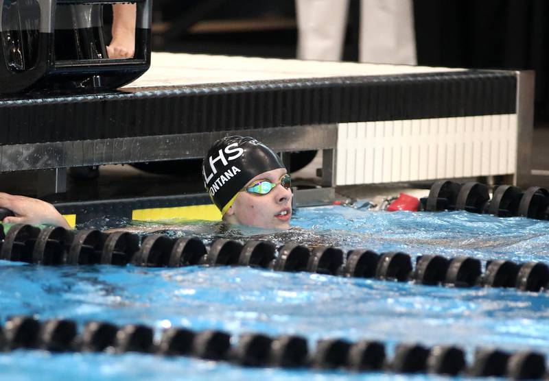Crystal Lake co-op’s Isabella Fontana looks at the clock following the 200-yard freestyle consolation heat during the IHSA Girls State Championships on Saturday, Nov. 16, 2024 at FMC Natatorium in Westmont.