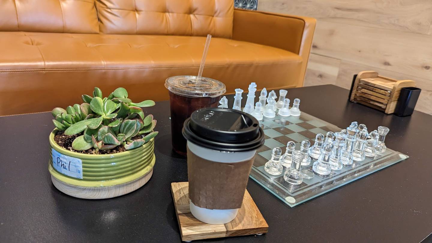 Tea and coffee in to-go cups are seen at Tazza Coffee in Joliet, on Wednesday, May 17, 2023.