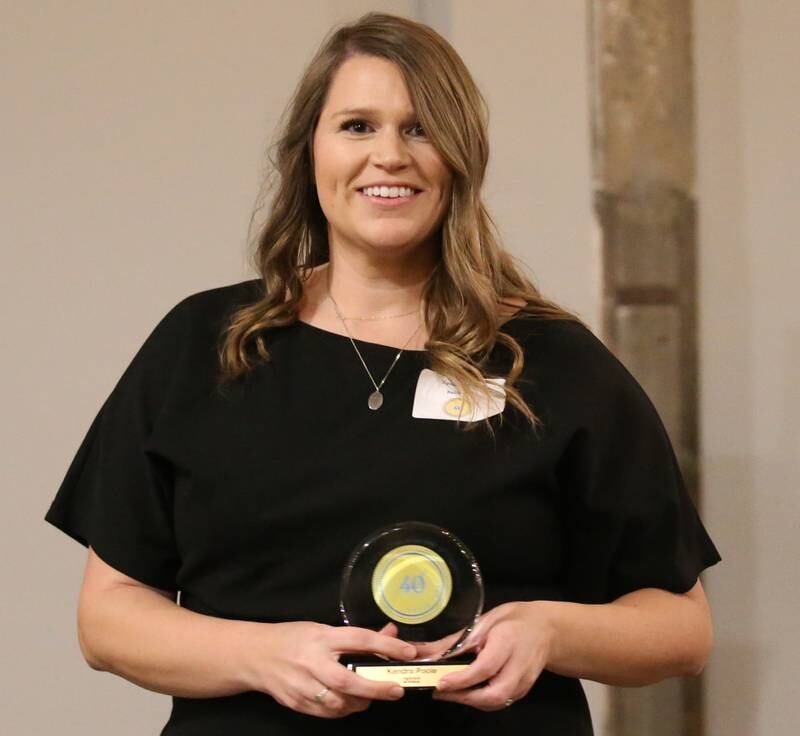 Kendra Poole, Owner/Family Nurse Practitioner, Kendra Poole INC (Collective Family Health) poses for a photo with her award during the Illinois Valley Chamber of Commerce 40 Under Forty Awards Gala on Thursday, Feb. 9, 2023 at Westclox in Peru.