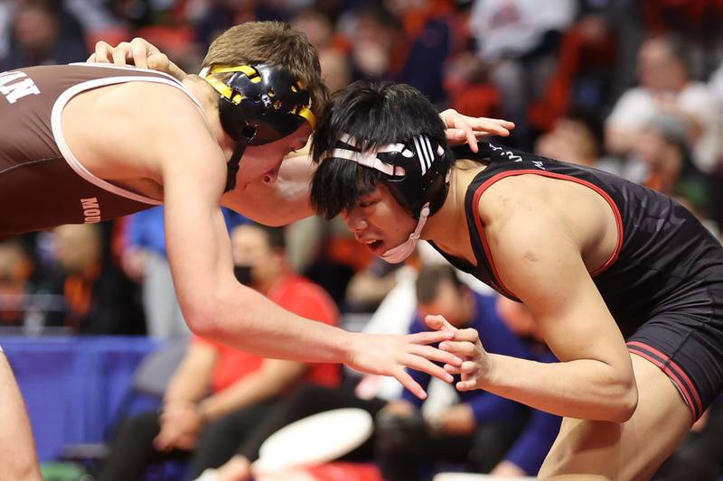 Plainfield North’s Jacob Macatangay works against Mt. Carmel’s Sergio Lemley in the Class 3A 126lb. semifinals at State Farm Center in Champaign. Friday, Feb. 18, 2022, in Champaign.