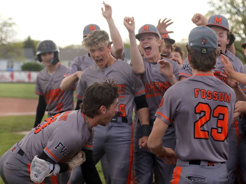 McHenry's Nathan Neidhardt (left) celebrates his home run with his teammates during a Fox Valley Conference baseball game against Huntley on Tuesday, May 8, 2026, at Huntley High School.