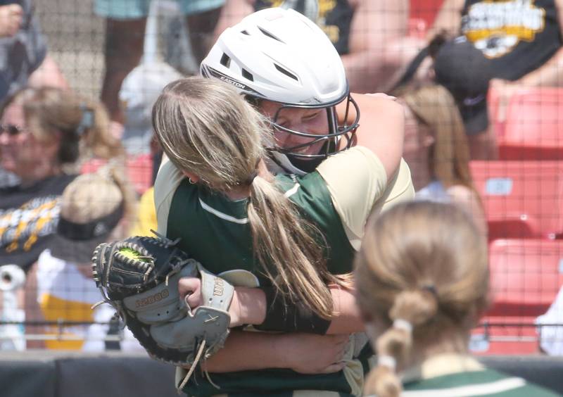 St. Bede catcher Bella Pinter hugs pitcher Ella Hermes after winning the Class 1A State semifinal game on Friday, June 2, 2023 at the Louisville Slugger Sports Complex in Peoria.