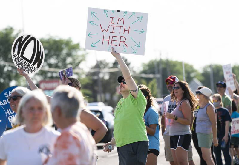 Tim Smalley, of Palatine, shows his support during a protest Friday, June 24, 2022, over the overturning of Roe v. Wade, organized by the McHenry County National Organization for Women. On Friday, the U.S. Supreme Court overturned the decades-old ruling that upheld the right to an abortion.
