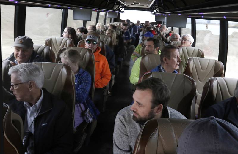 People look out the windows at the during the McHenry County Sand and Gravel Mining Tour on Thursday, Oct. 12, 2023. The tour brought McHenry County board members, township and village officials on a four hour trip to visit operating mines on Route 23 in Marengo and to former sites now reclaimed for housing, recreation in Algonquin and Cary.