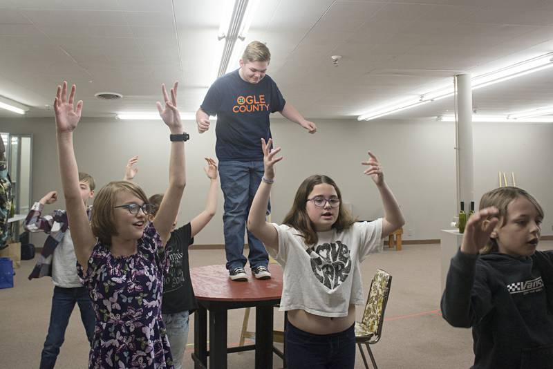 Joshua Snow, playing the part of Tevye in “Fiddler on the Roof Jr.” rehearses a dance scene Thursday, May 5, 2022. The real life tale takes place during Russia’s first invasion of Ukraine. Some proceeds from the ticket sales will go to help the children in Ukraine.