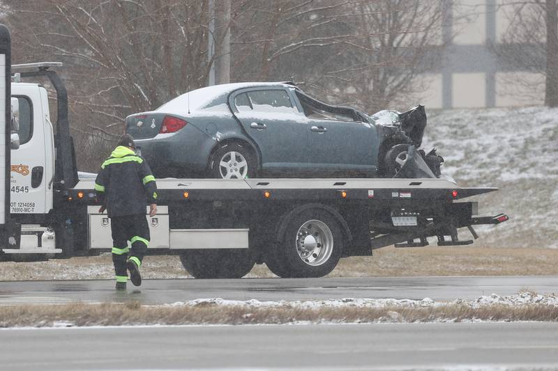 A vehicle gets ready to be towed along southbound South Chicago Street at the scene of a deadly accident killing one person involving a semi and a vehicle on Friday Feb. 16th, 2024 in Joliet.