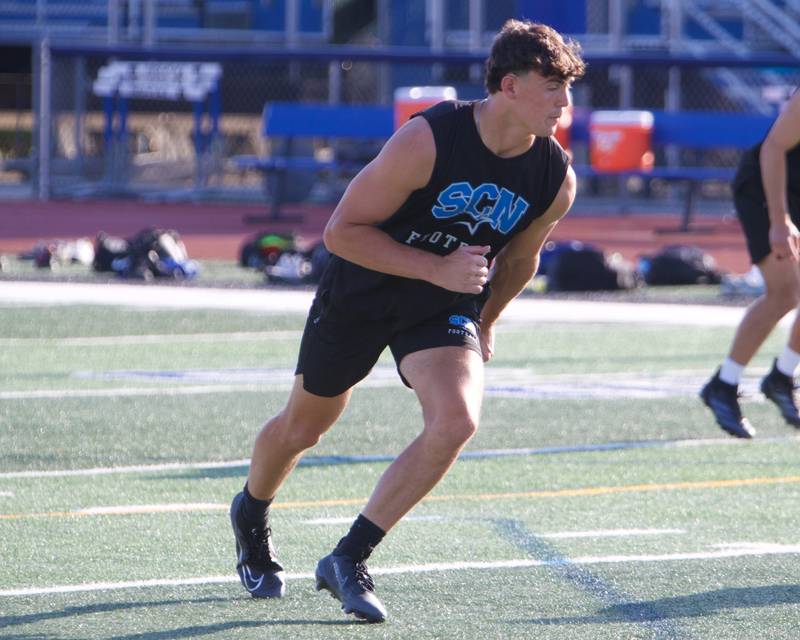 St. Charles North's Aidan McClure runs a drill at the first practice on Monday, Aug.11,2025 in St. Charles.
