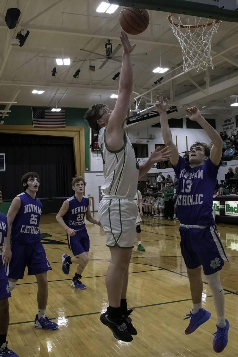Rock Falls' Chevy Bates shoots as Newman's Nolan Britt (13) defends during their nonconference game Wednesday, Feb. 15, 2023 at Tabor Gym.