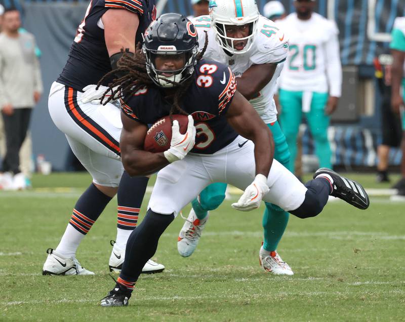 Chicago Bears running back Ian Wheeler finds running room in the Miami Dolphins defense Sunday, Aug. 10, 2025, during their game at Soldier Field in Chicago.