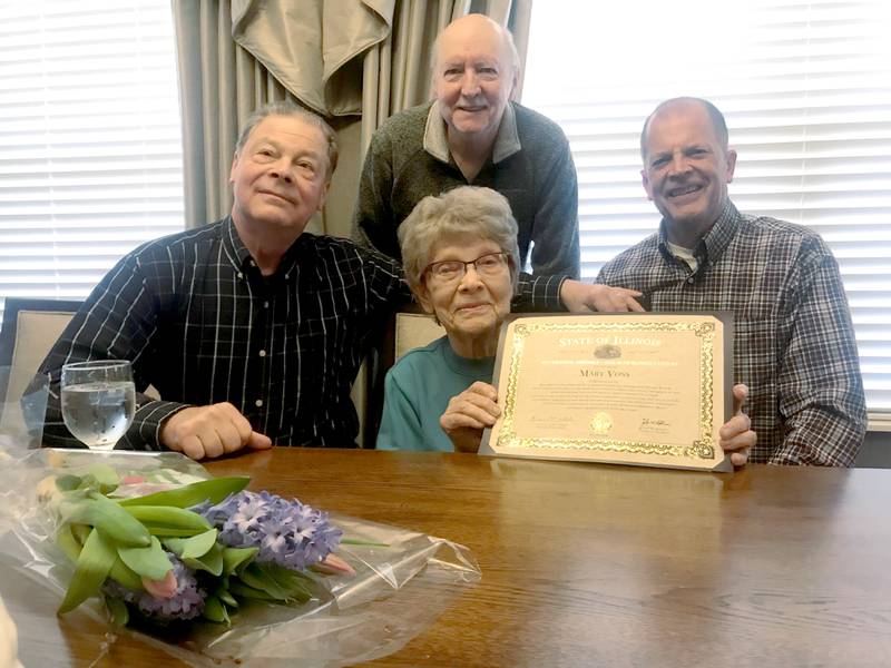 From the left, Bob VanZuiden of Morrison, Don Hall of Fulton, and Tom VanZuiden of Fulton are pictured with former Fulton resident Mary Voss at Bickford of Clinton on Friday, April 1. Voss, a retired nurse, was presented with a certificate from the State of Illinois 102nd General Assembly - House of Representatives recognizing her service as a nursing cadet in the United States Cadet Nurse Corps in the 1940s.