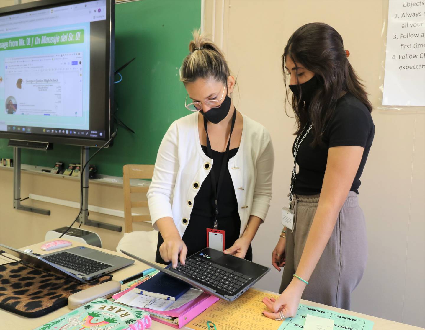 Joliet Public Schools District 86 welcomed three international teachers to the district at the start of the 2021-2022 school year. Denise Vuoto of Argentina (left), a bilingual English Language Arts teacher at Gompers Junior High works with eighth-grader Daniela Zamudio Lopez.