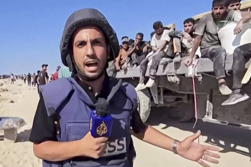 This undated recent image, taken from video broadcast by the Qatari-based television station Al Jazeera, shows the network's Arabic-language Gaza correspondent, Anas al-Sharif, reporting on camera in Gaza. Al-Sharif and four other Al Jazeera staff members were killed by an Israeli drone strike on their tent in Gaza City shortly before midnight on Sunday.