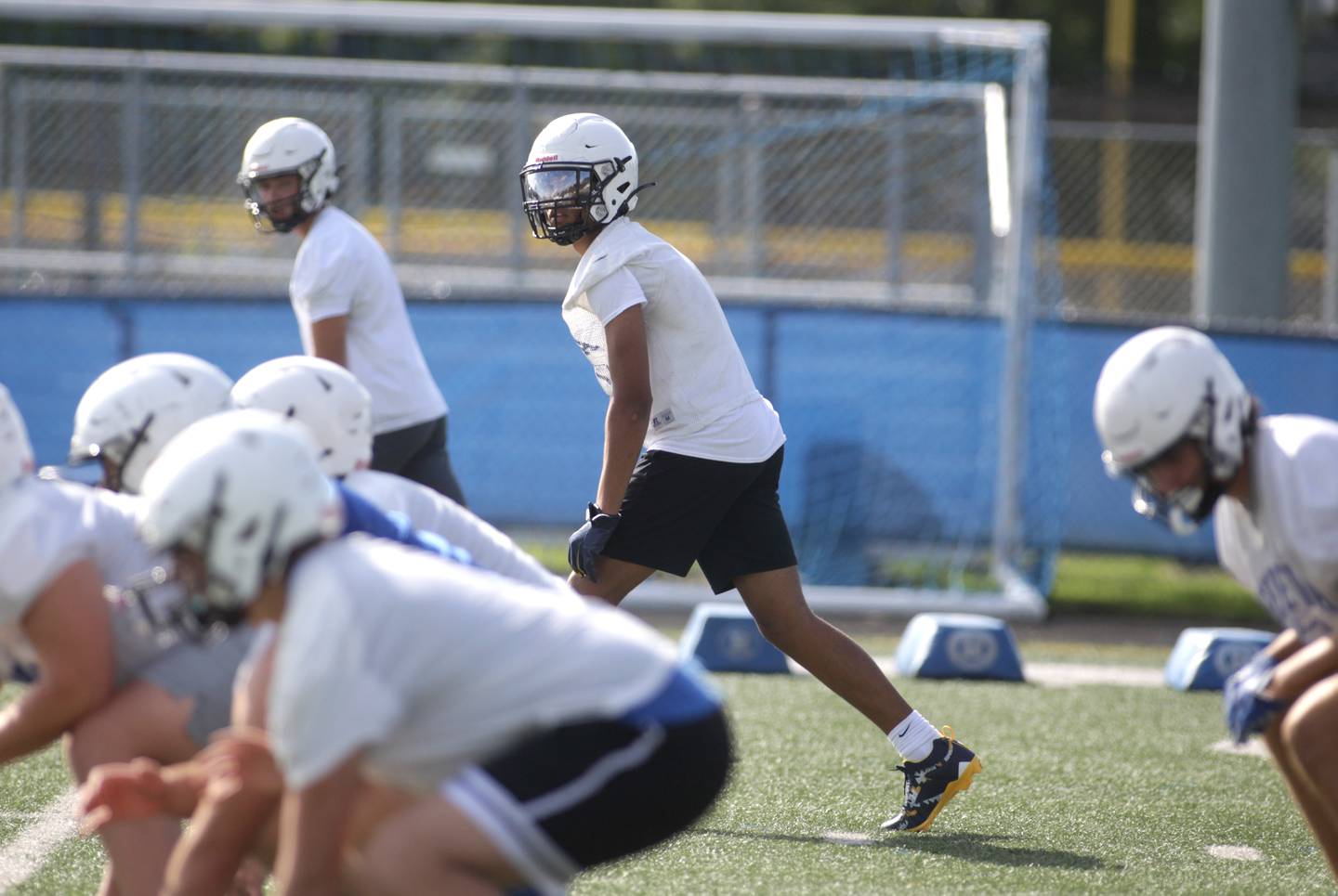 Geneva’s Talyn Taylor (center) lines up for a play during the first day of practice for the fall season on Monday, Aug. 7, 2023 at the school.