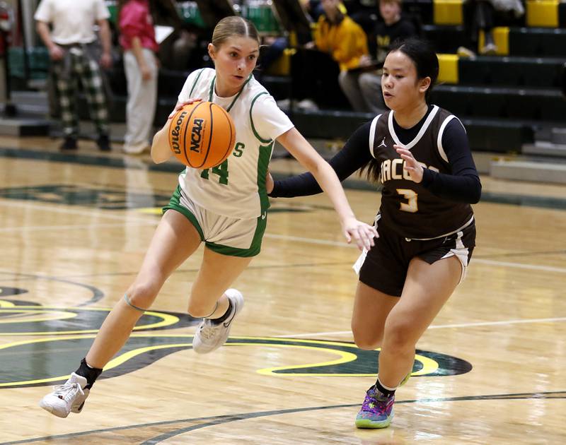 Crystal Lake South's Makena Cleary drives into the lane against Jacobs' Sophia Acot during a Fox Valley Conference basketball game on Friday, Jan. 17, 2025, at Crystal Lake South High School.