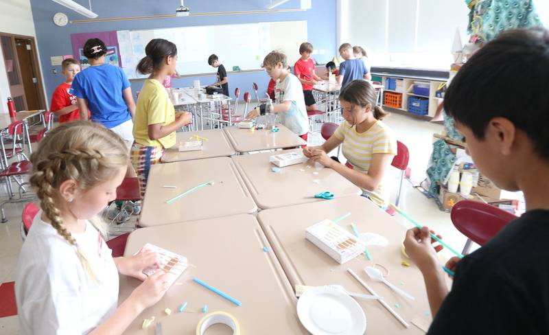 Students make instruments during Camp Invention at Central Intermediate School on Thursday, June 15, 2023 in Ottawa.