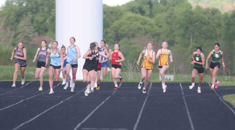 Runners hand off the batons in the 4x100 relay during the Class 1A Sectional meet on Wednesday, May 8, 2024 at Bureau Valley High School.